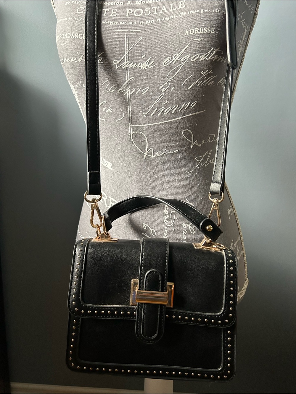 Boho-Western black crossbody with gold hardware.